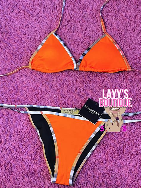 orange burberry swimsuit.